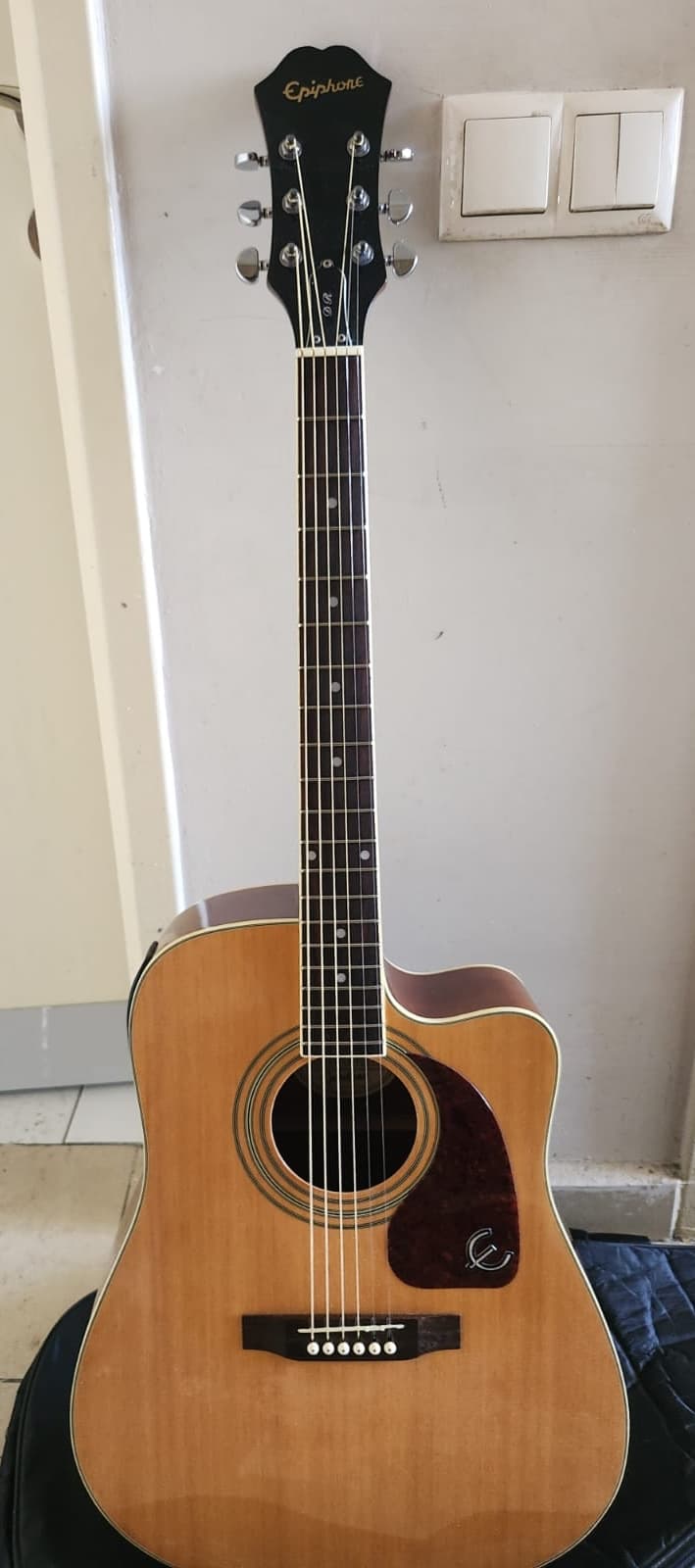 Acoustic guitar - original phone photo before AI enhancement
